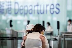 Airport echoes with sobs and farewells in Hong Kong exodus.jpg