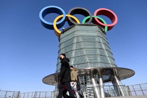 Tokyo hands Olympic baton to Beijing but virus, boycott calls weigh