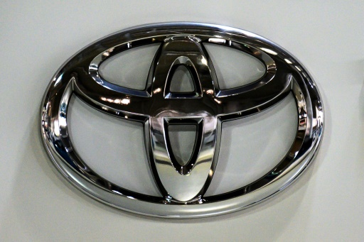 Toyota cuts production further on virus issues, chip woes