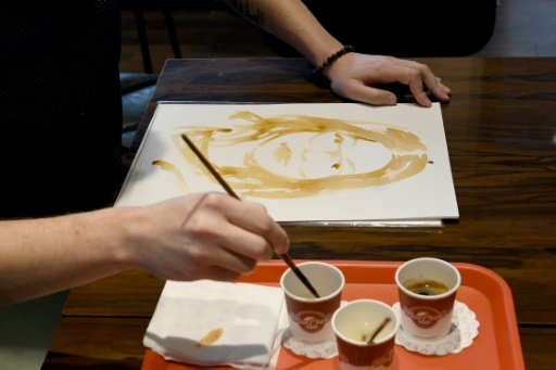 Albanian artist offers 'therapy' with portraits painted in coffee