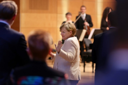 Merkel urges compromise at start of tough coalition talks.jpg