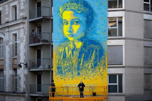 Paris graffiti legend C215 on his Ukraine mural