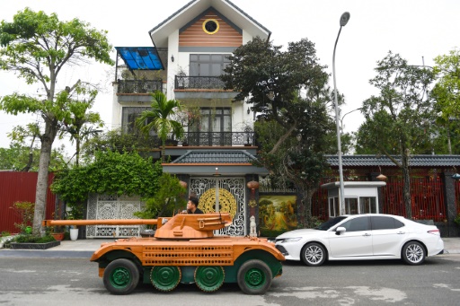 Vietnamese dad spends thousands converting van into wooden tank for son