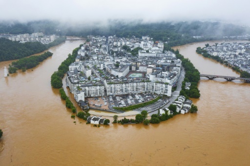 Hundreds of thousands evacuated in China after heaviest rains in decades