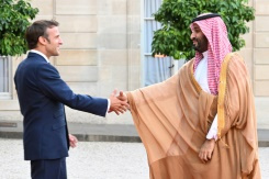 Macron defies anger to welcome Saudi strongman.jpg