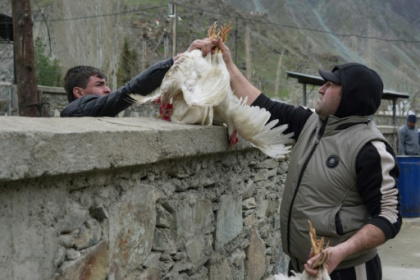 Afghans and Tajiks mix in rare but vital border bazaar.jpg