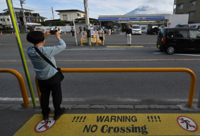 Sick of tourists, Japan town blocks view of Mt Fuji.jpg