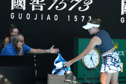 Sofia Kenin consults her coach in the new on-court coaching pods