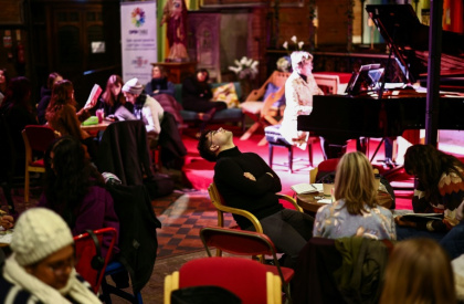 People read, write and draw in silence while listening to pianist Maria Garzon as part of a digital detox night out organised by the Offline Club in London