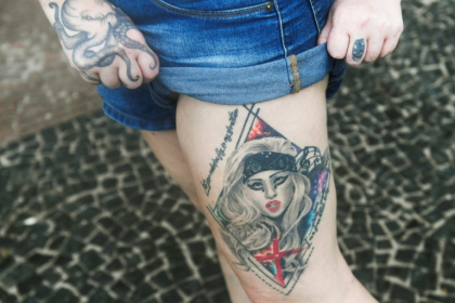 A fan shows a tattoo of US singer Lady Gaga at Rio's Copacabana Beach, where the pop star will stage a free concert - Daniel RAMALHO (AFP) A fan shows a tattoo of US singer Lady Gaga at Rio's Copacabana Beach, where the pop star will stage a free concert - Daniel RAMALHO (AFP)