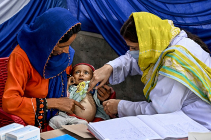 A doctor examines a child during a UNICEF nutrition programme at Fateh Muhammad Soomro village in Sindh - Rizwan TABASSUM (AFP) A doctor examines a child during a UNICEF nutrition programme at Fateh Muhammad Soomro village in Sindh - Rizwan TABASSUM (AFP)